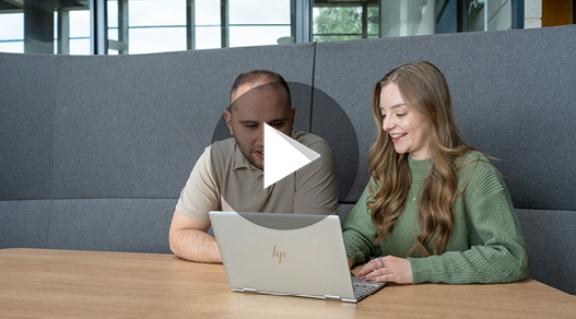 2 students with a laptop